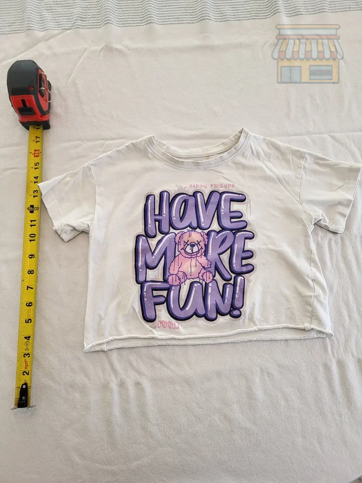 Girls' White Crop Top with Fun Graphic • Condition: Excellent • Location: Davie, FL • Price: Free